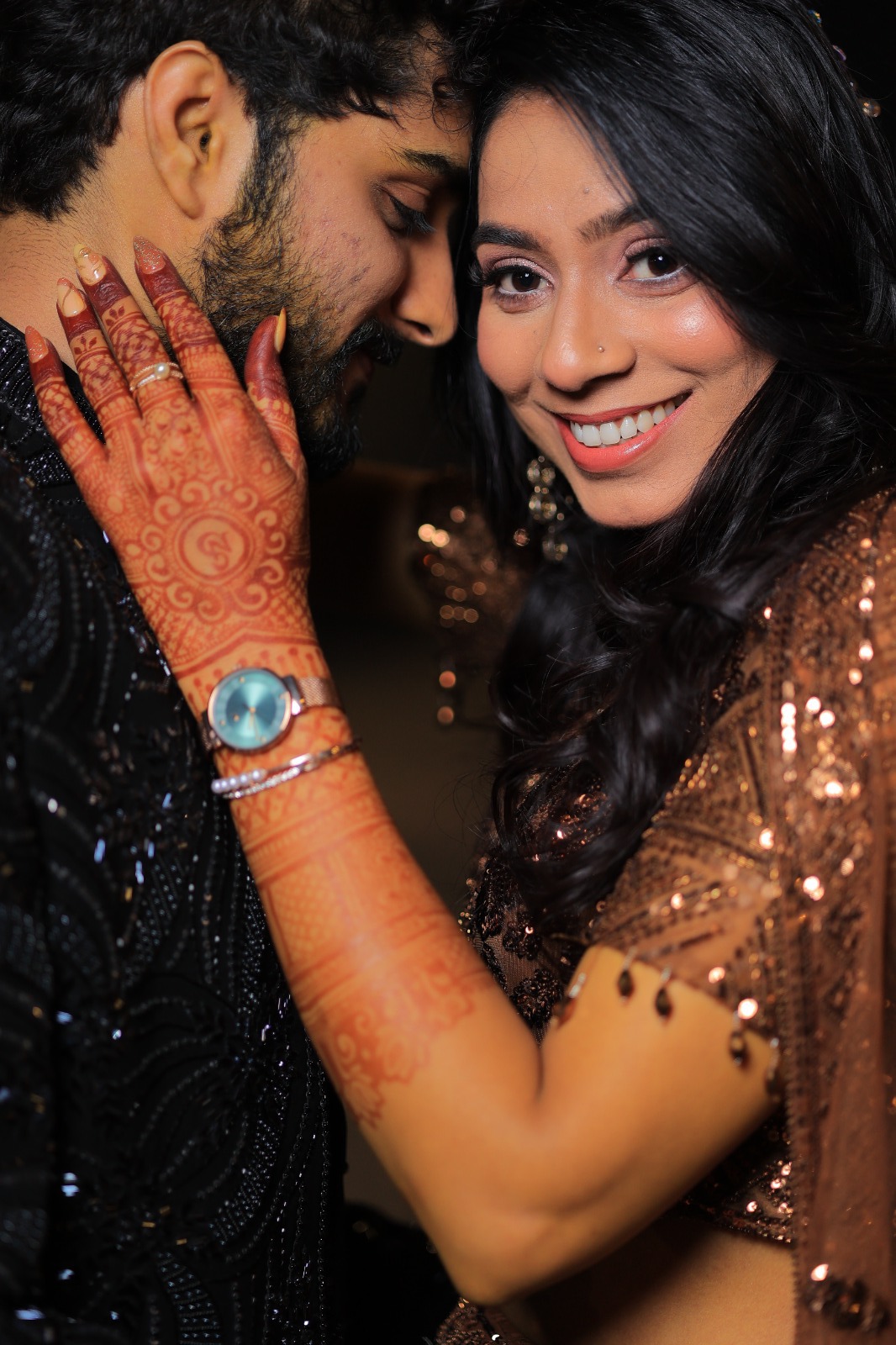 Bride's henna-covered hands during a mehndi ceremony